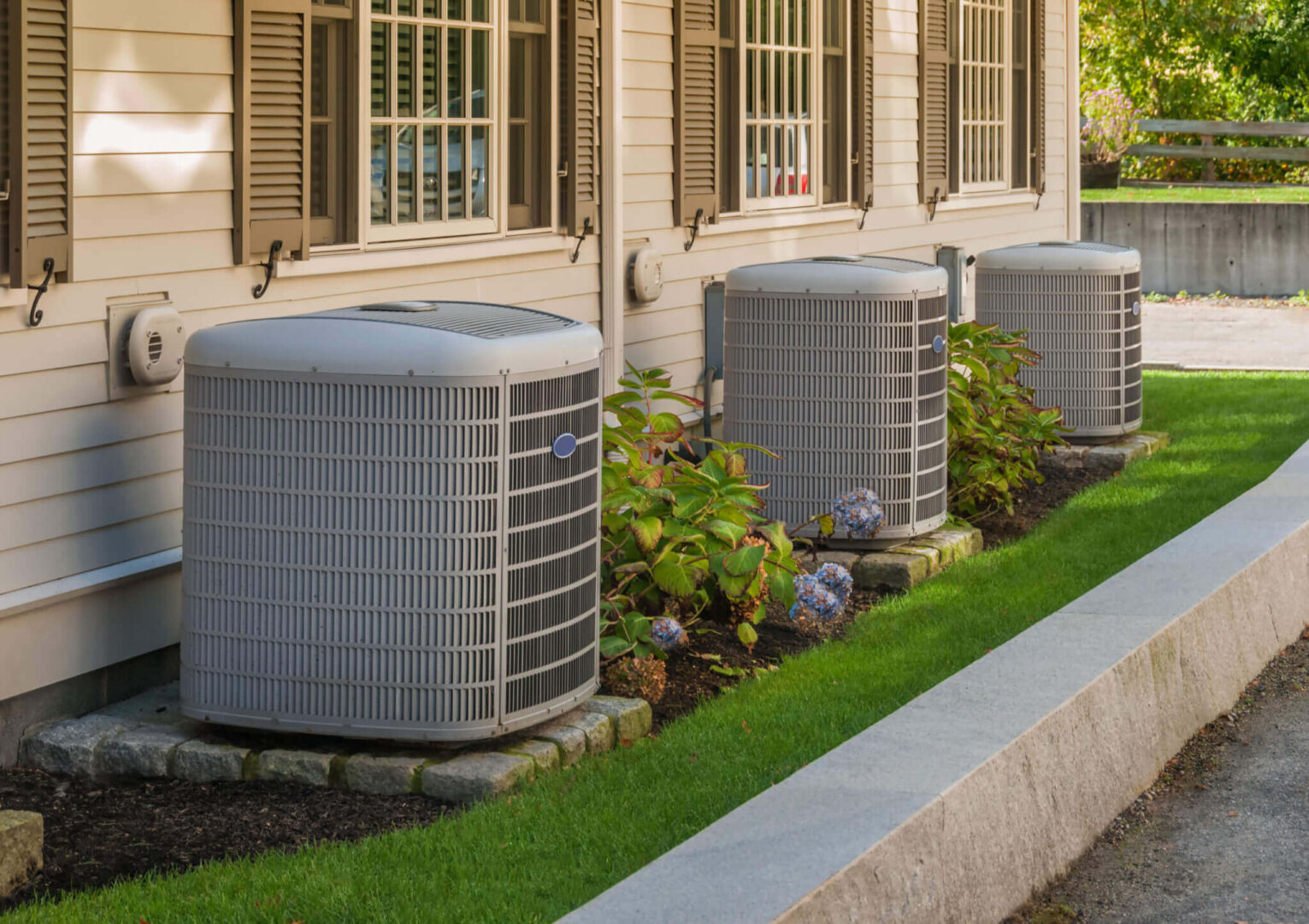 Outdoor condenser unit installed at a home